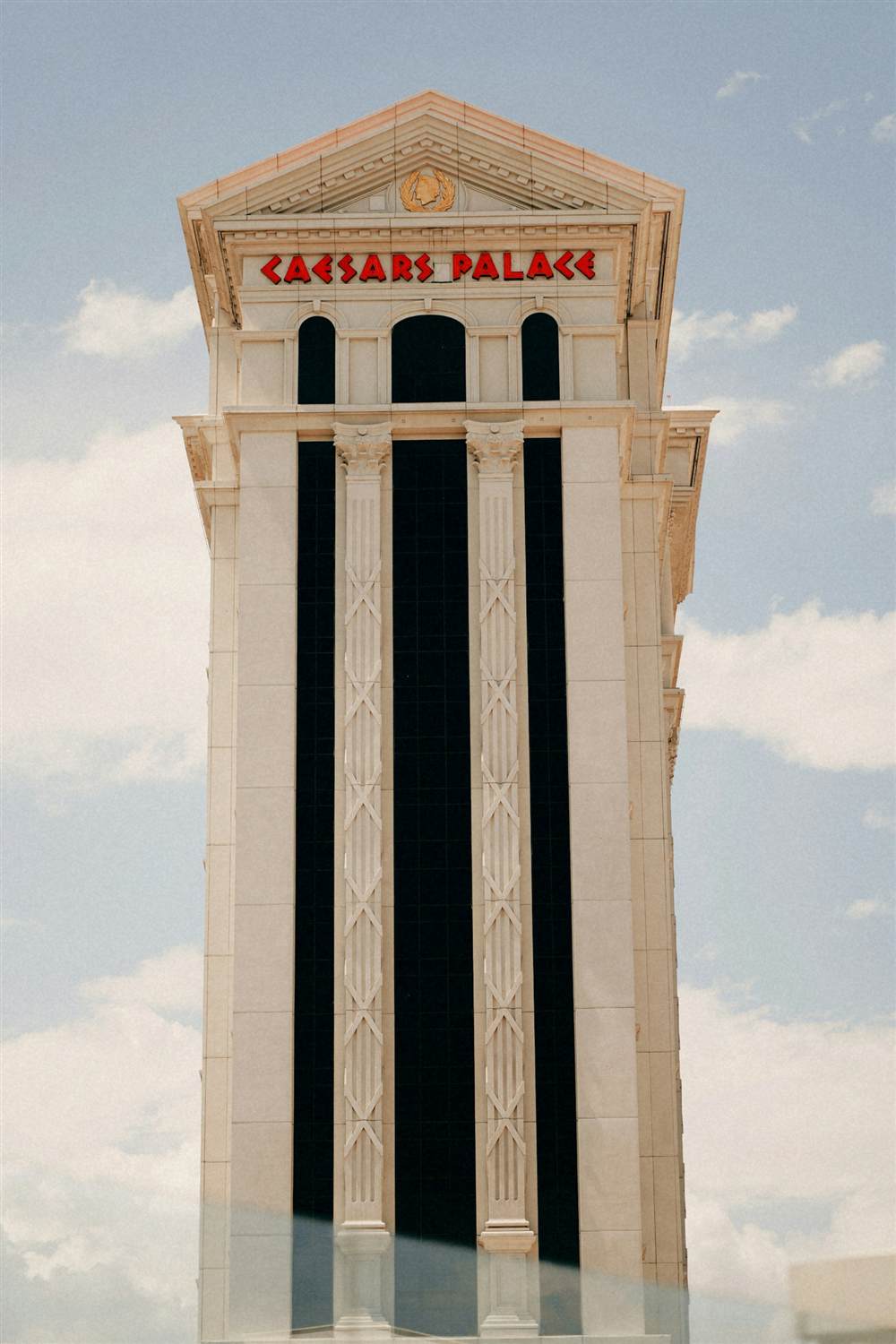 The Caesars Palace hotel tower against a blue sky
