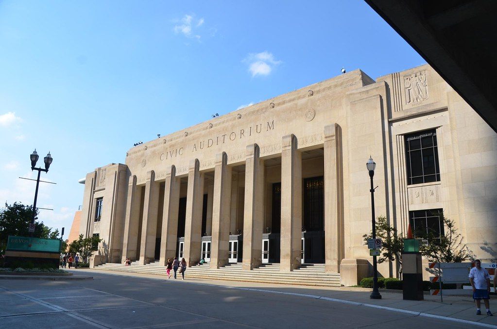 The limestone Civic Auditorium facade at DeVos Place, with tall columns and