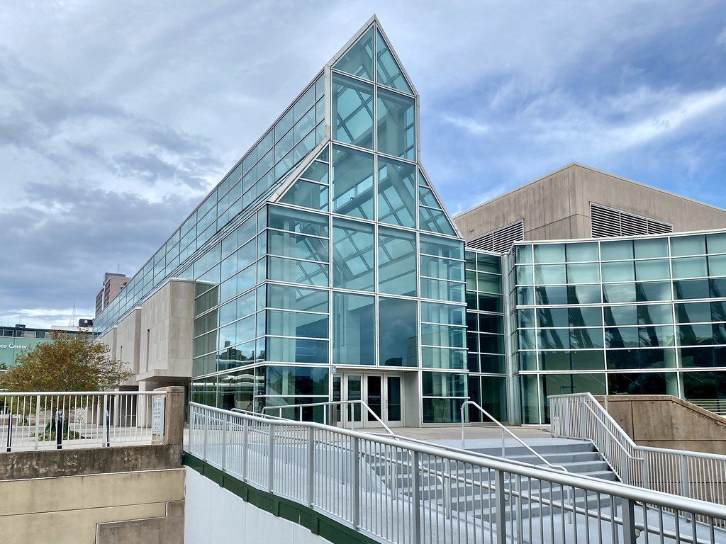 The glass-peaked entrance of the Knoxville Convention Center on Henley Street