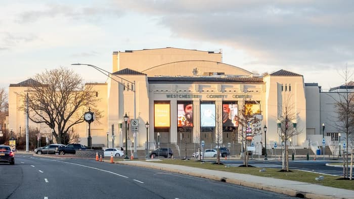 The cream Art Deco facade of the Westchester County Center on Central Avenue, with WESTCHESTER COUNTY CENTER lettering and video screens over the entrance