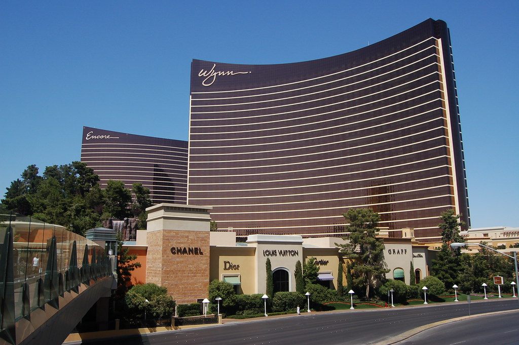 The curved bronze towers of Wynn Las Vegas and Encore above the Esplanade shops on Las Vegas Boulevard
