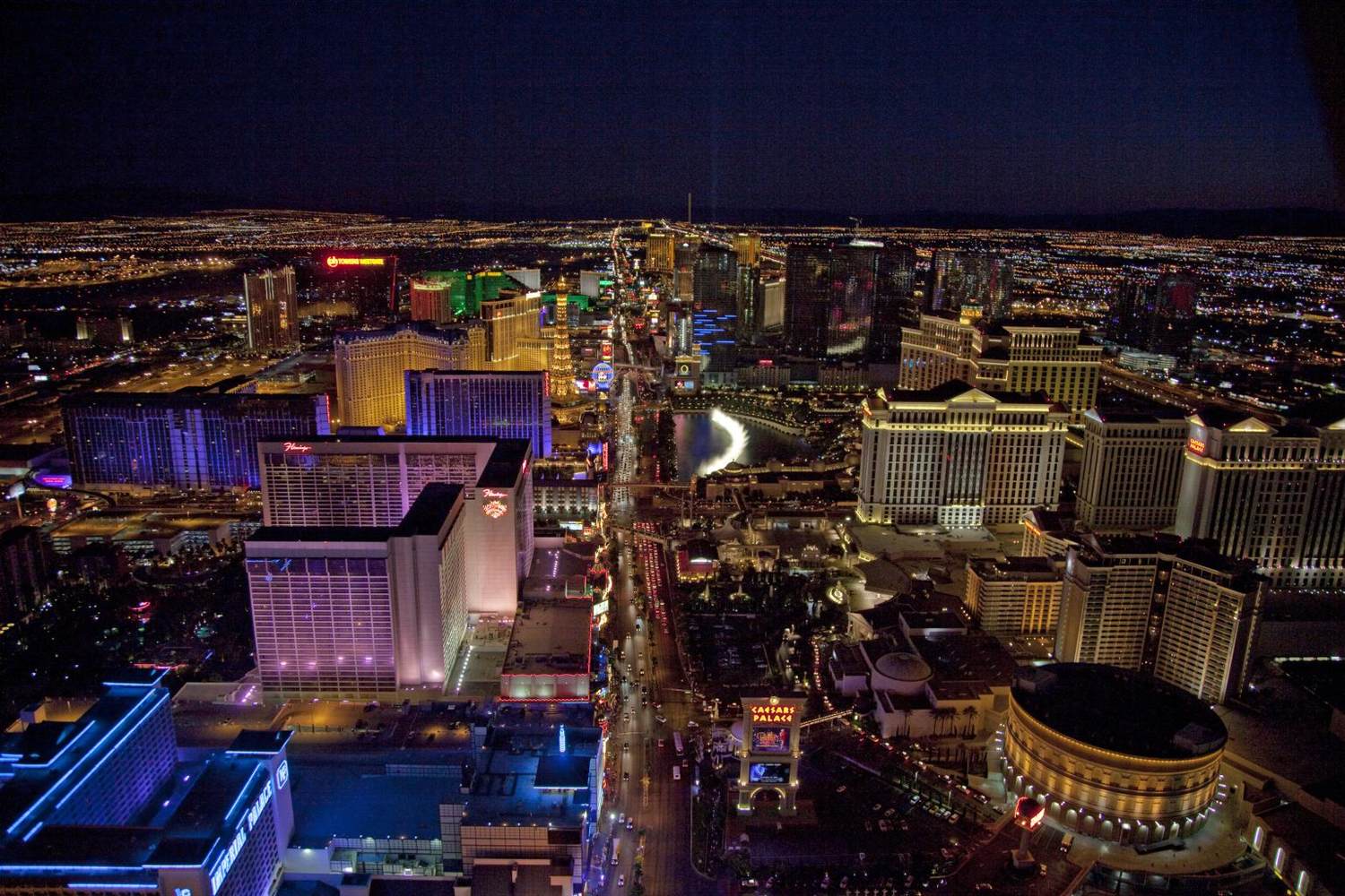 Night aerial view of the center Strip with Caesars Palace, the Bellagio fountains, the Flamingo and Paris