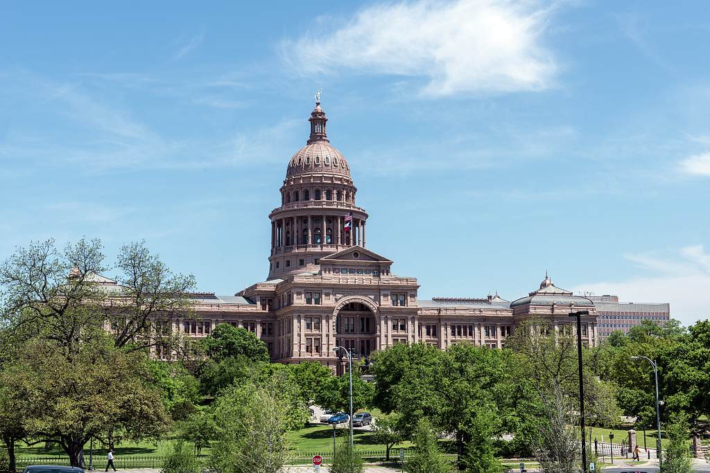 The Texas Capitol in Austin under a blue sky