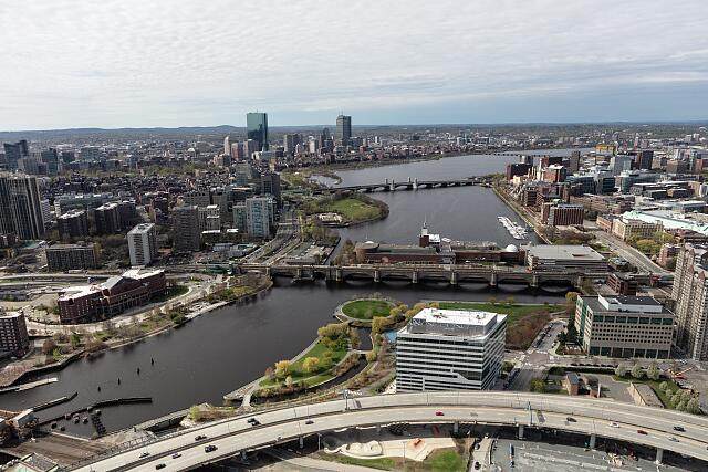 Aerial view of bridges over the Charles River with the Boston, Massachusetts skyline in the distance