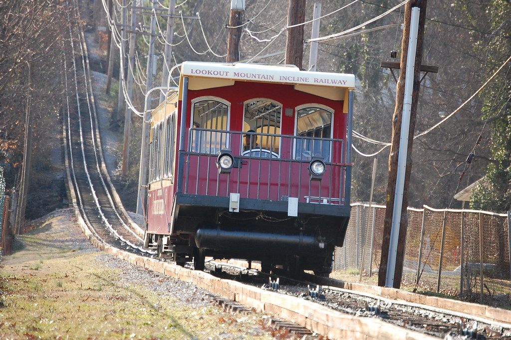A red Lookout Mountain Incline Railway car climbing the steep track