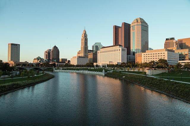 Skyline view of downtown Columbus, Ohio from along the Scioto River at sunset