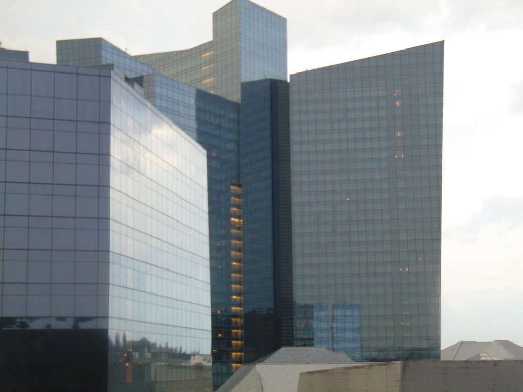 Close view of Mohegan Sun's glass hotel tower facades reflecting the evening sky