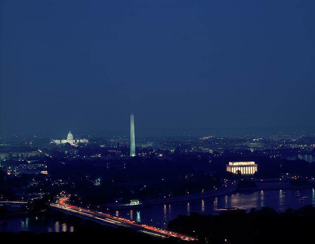 Night aerial view of Washington, D.C. with the Capitol, Washington Monument and Lincoln Memorial illuminated