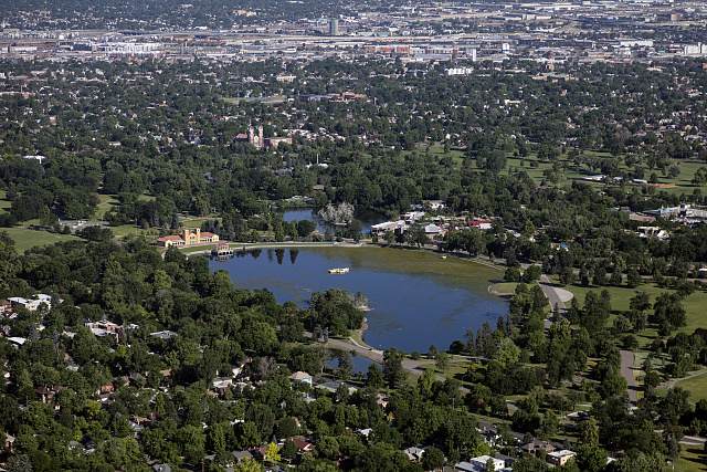 Aerial view across a lake in City Park to downtown Denver, Colorado