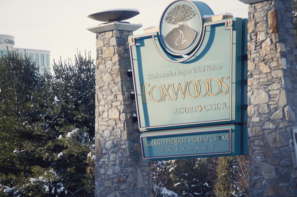 The stone-pillared Foxwoods Resort Casino entrance sign, reading Mashantucket Pequot Tribal Nation above the Foxwoods name, in winter