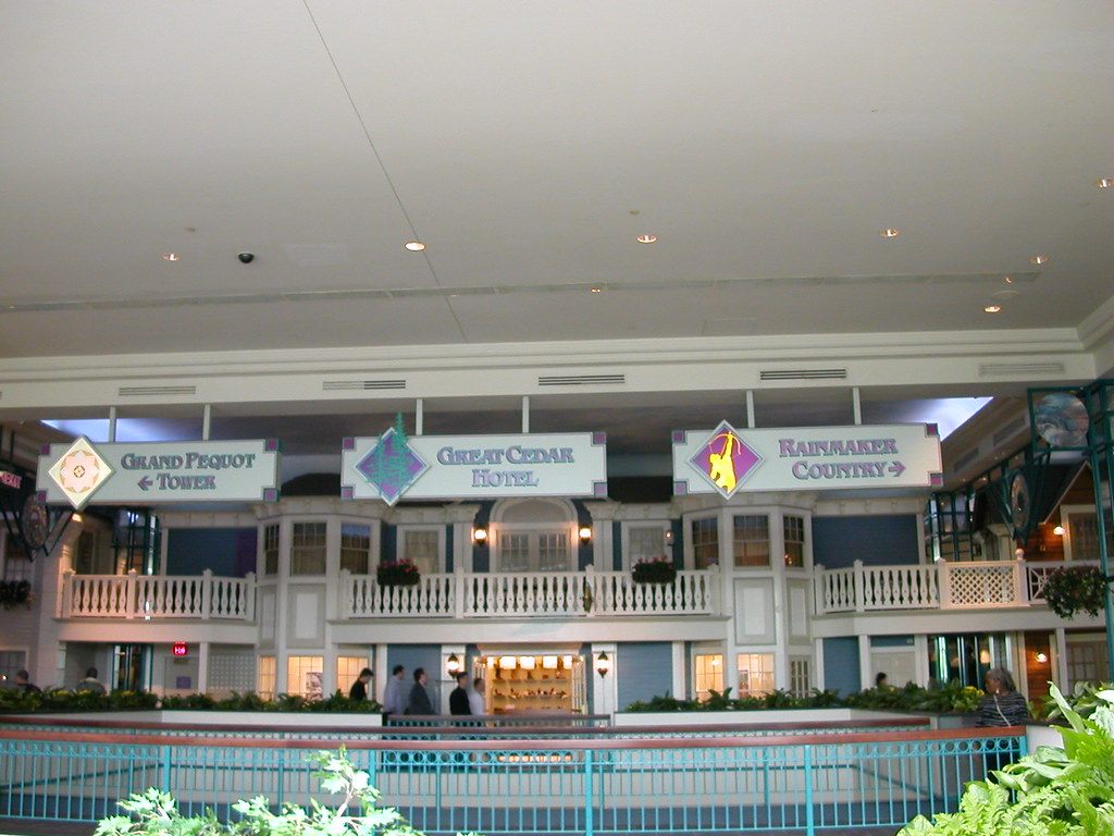 Wayfinding signs inside Foxwoods pointing to the Grand Pequot Tower, the Great Cedar Hotel and Rainmaker Country