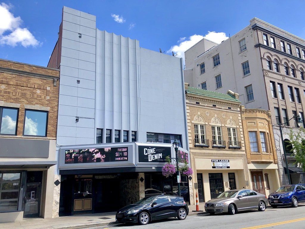 The Cone Denim Entertainment Center marquee and early-1900s storefronts on South Elm Street, downtown Greensboro