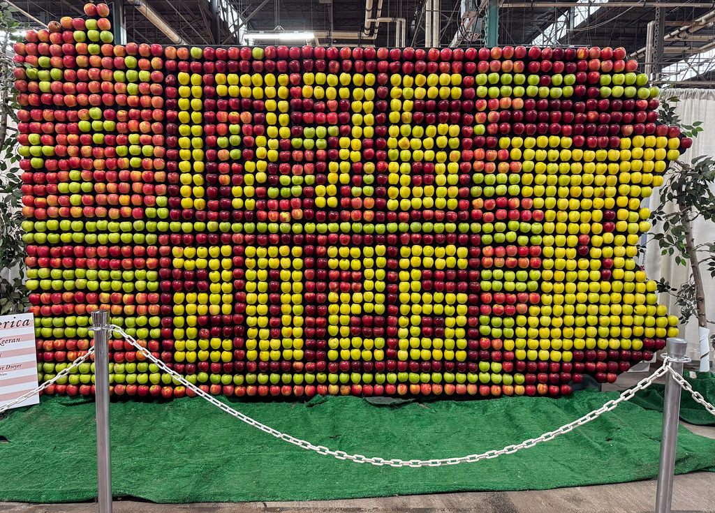 A wall of red, yellow and green apples arranged in the shape of Pennsylvania at the 2026 Farm Show