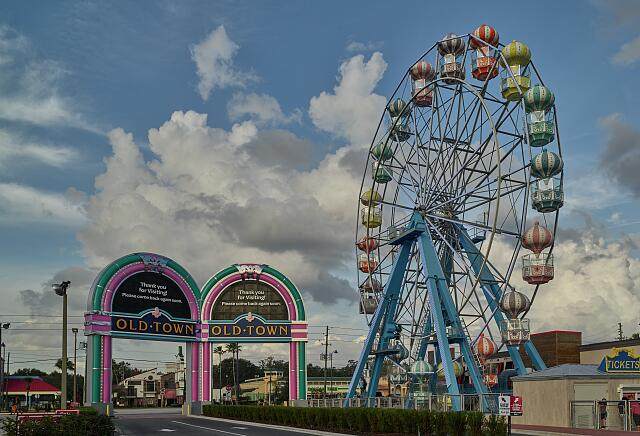 A Ferris wheel lit at dusk at the Old Town amusement park in Kissimmee, Florida