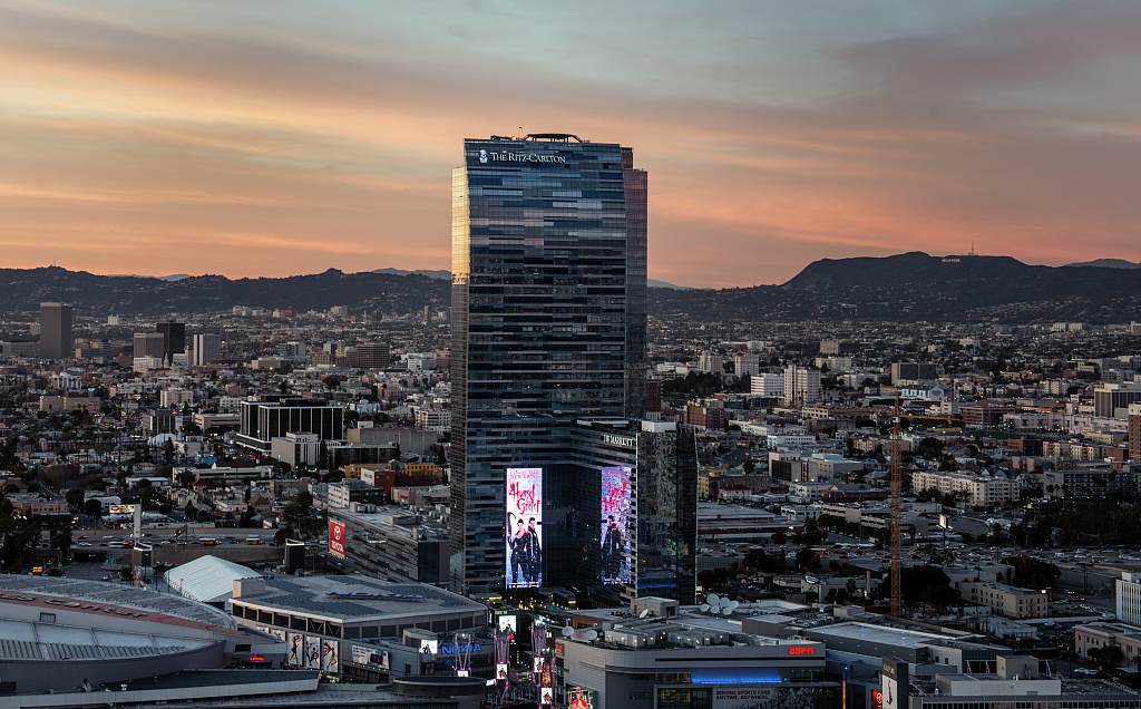 The Los Angeles skyline at dusk with the Ritz-Carlton Hotel tower