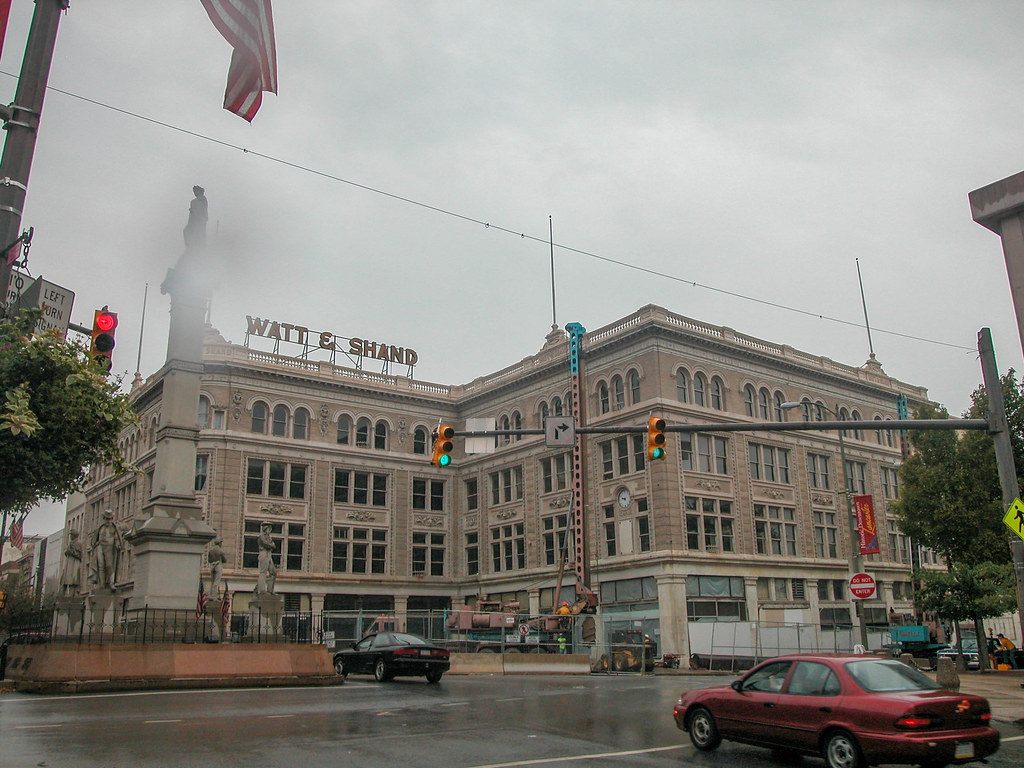 The Watt & Shand department store building on Penn Square in 2006, with its rooftop sign, before it was gutted behind its facade for the convention center