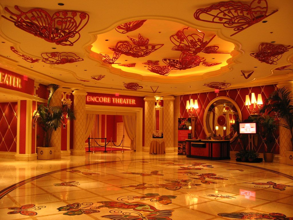The red and gold lobby outside the Encore Theater, with butterfly mosaics in the marble floor and on the ceiling