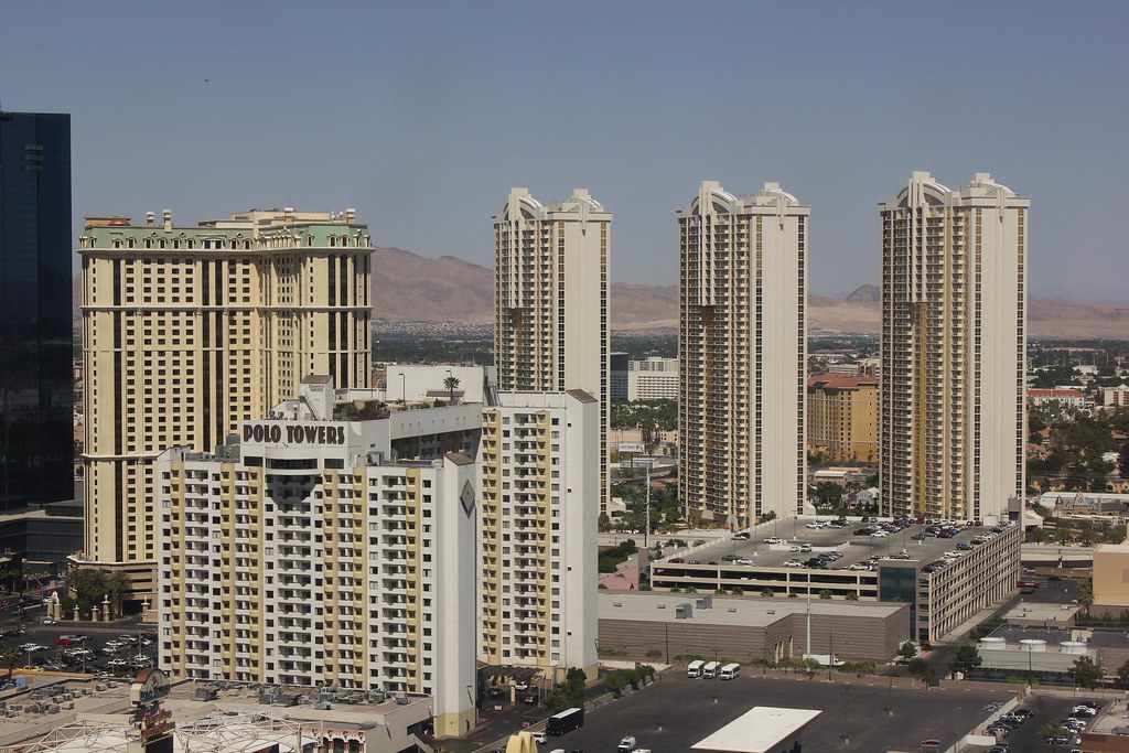 The three cream-colored towers of The Signature at MGM Grand, with Polo Towers in front