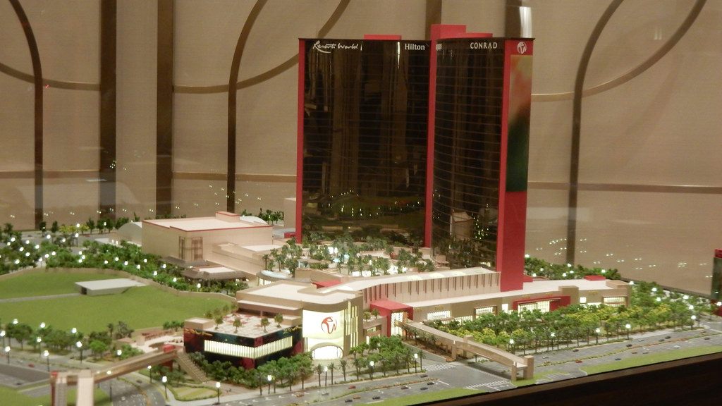A scale model of Resorts World Las Vegas showing the two towers, the low-rise podium and landscaped grounds