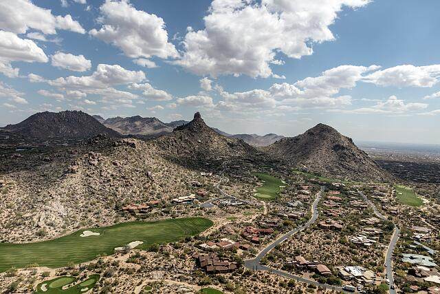 Golf courses among the McDowell Mountains near Scottsdale, Arizona, with Pinnacle Peak in the distance