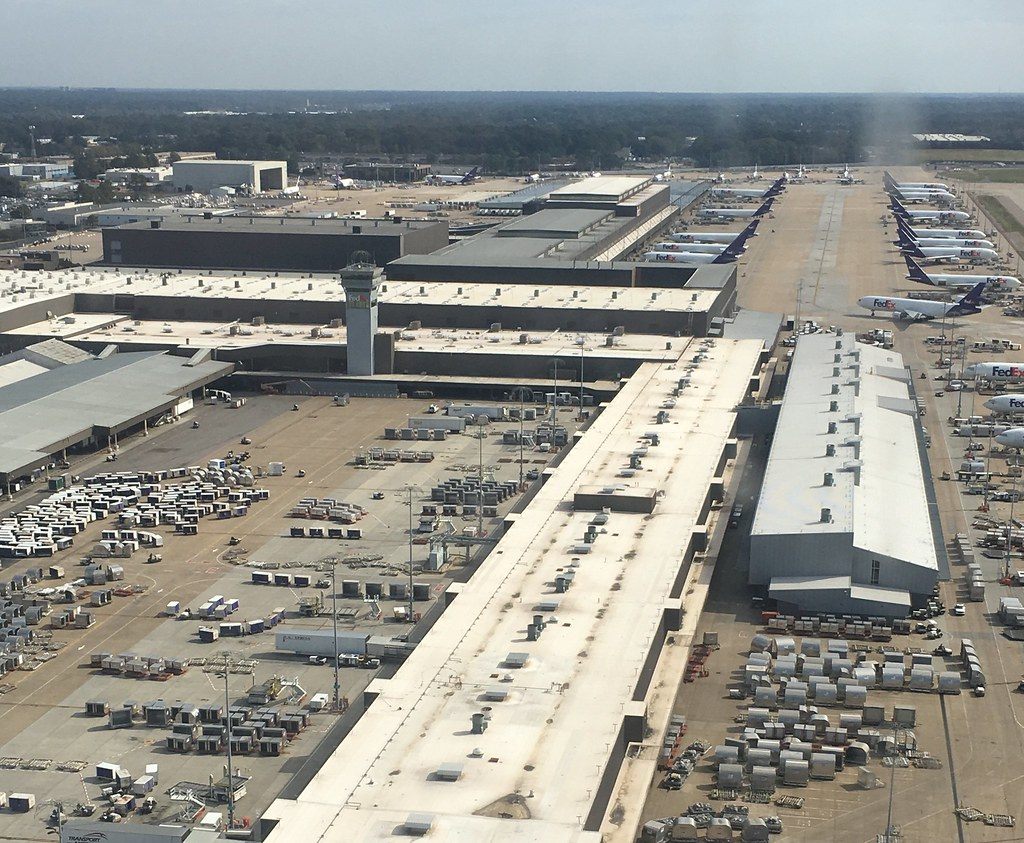 Aerial view of the FedEx hub sort buildings and parked cargo jets at Memphis International Airport