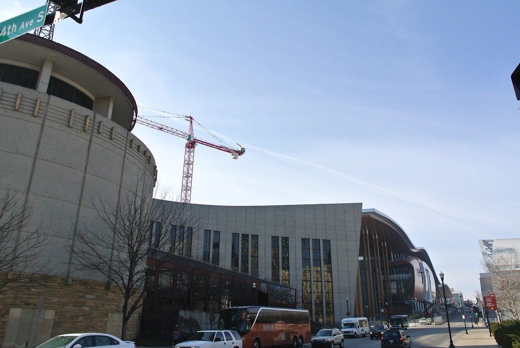 The rotunda of the Country Music Hall of Fame, with the curved roofline of the Music City Center down the street