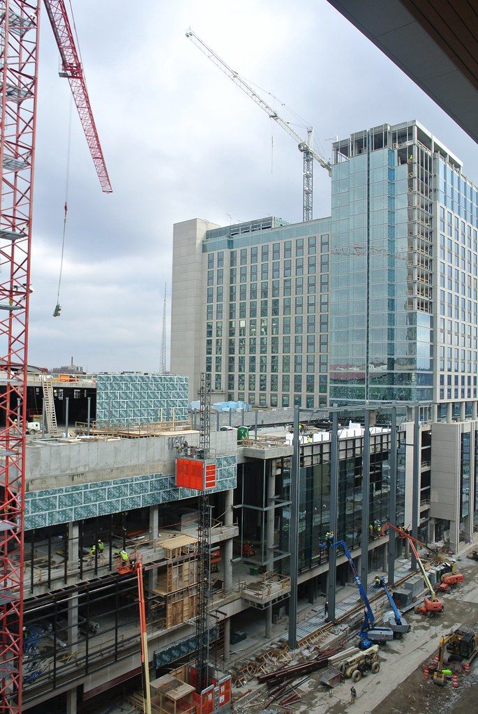 The Omni Nashville tower under construction behind the Hall of Fame expansion, seen from the Music City Center
