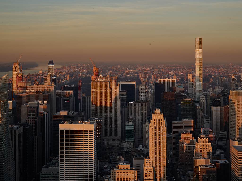 Dusk view of Midtown Manhattan with the slender tower of 432 Park Avenue