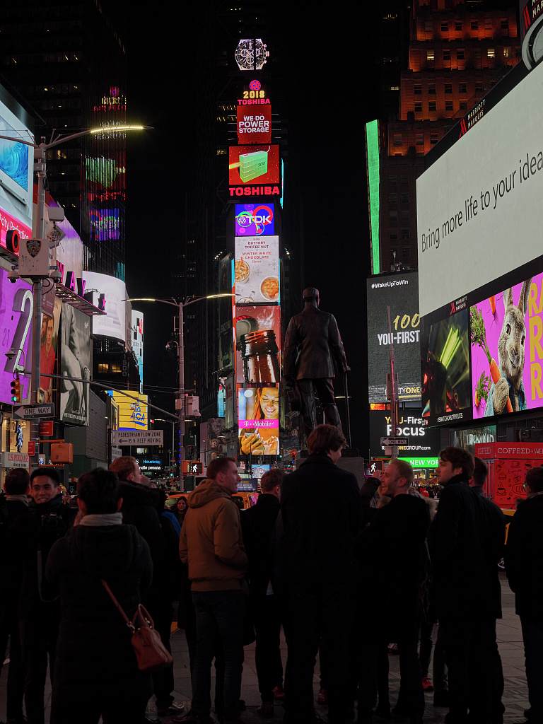 Times Square at night with illuminated billboards
