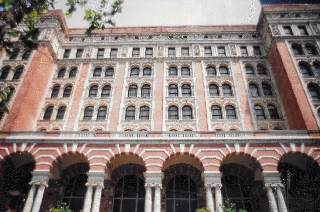 The arched brick and terra-cotta facade of the 1893 Reading Terminal headhouse on Market Street