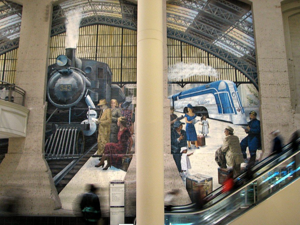 A mural of steam and streamlined trains under the Reading Terminal train shed, photographed inside the Pennsylvania Convention Center