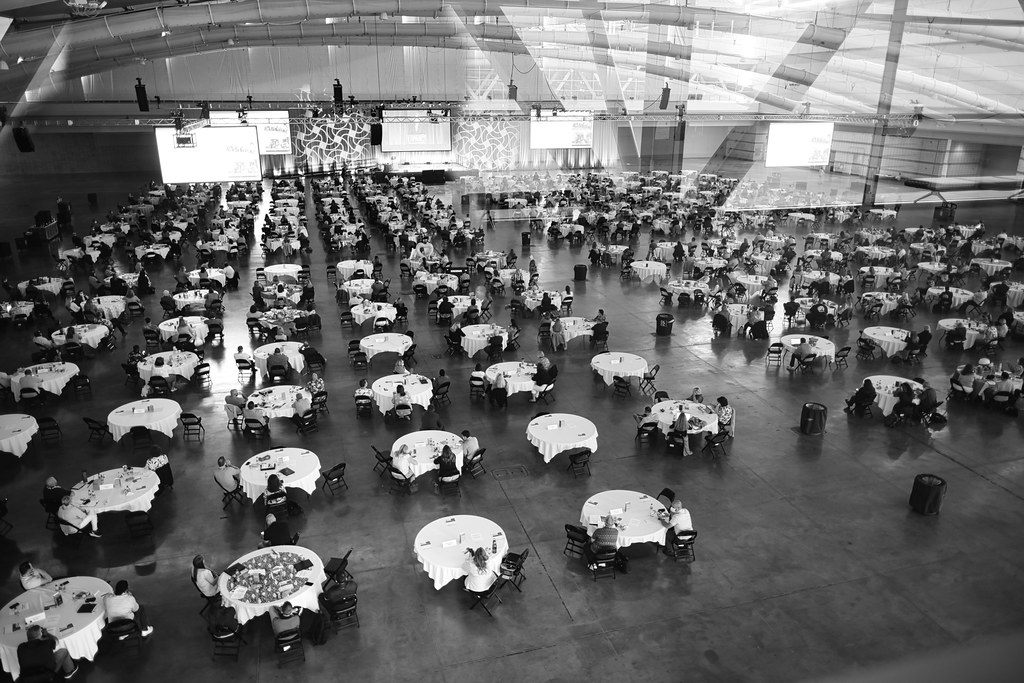 Round banquet tables set up across the column-free exhibit hall of the David L. Lawrence Convention Center