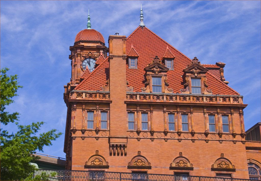 The red tile roof, clock tower and terracotta facade of Main Street Station in Shockoe Bottom, Richmond