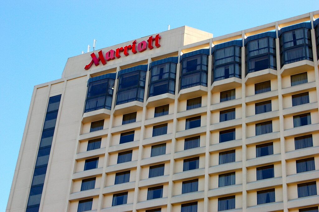 The upper floors and red Marriott sign of the Richmond Marriott Downtown, the hotel next to the convention center