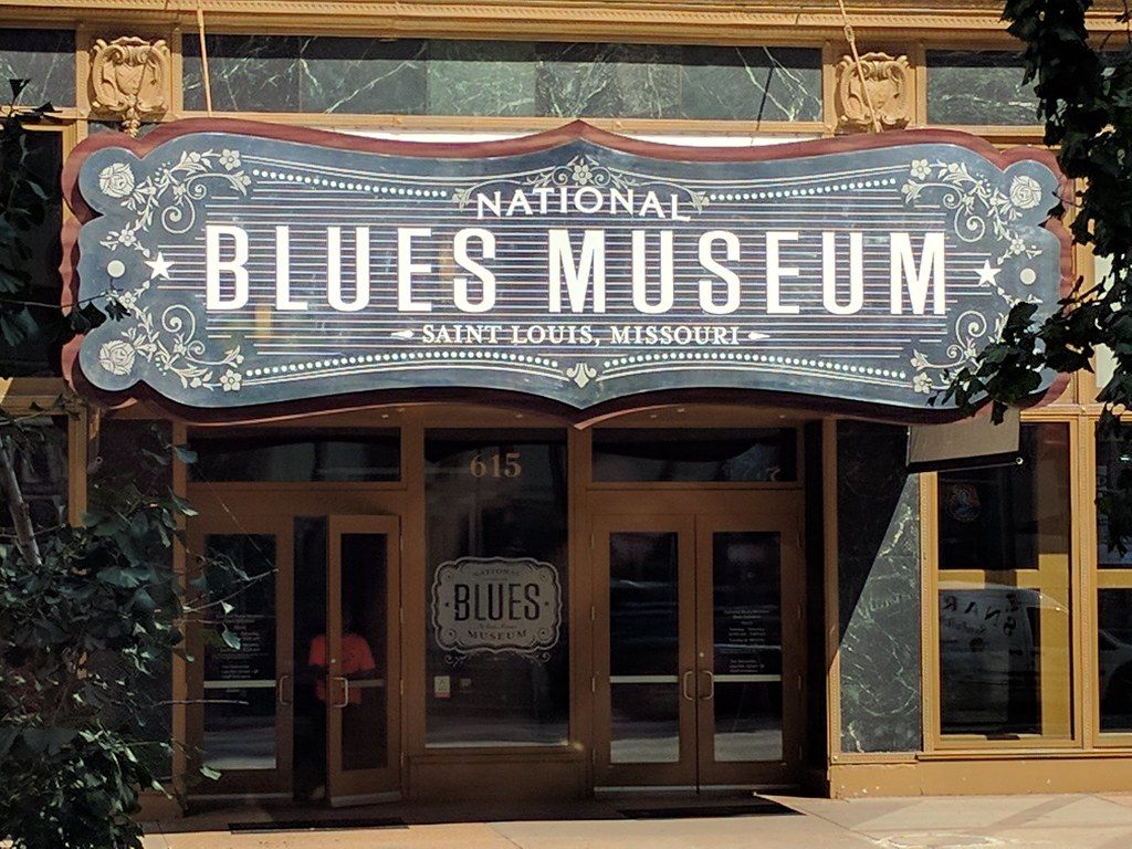 The ornate National Blues Museum sign above glass doors at 615 Washington Avenue