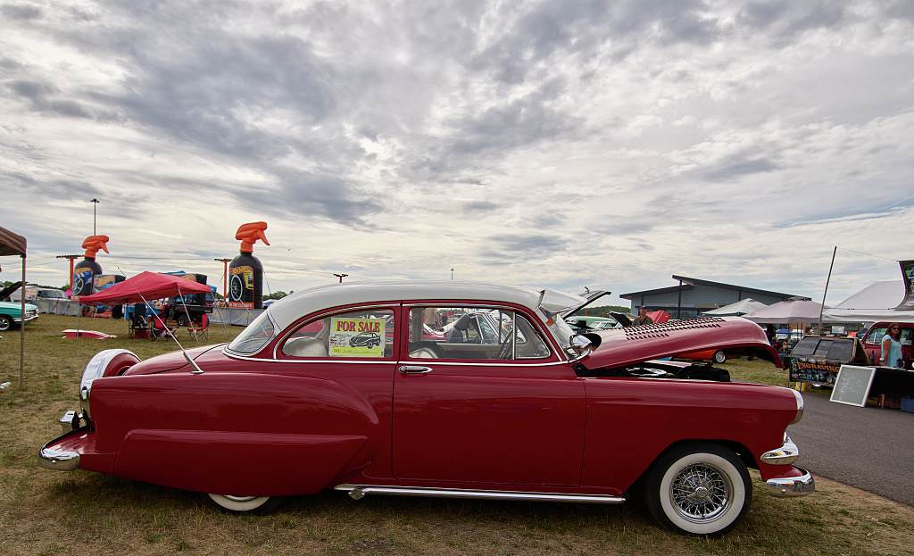 A restored red Chevrolet at the Syracuse Nationals car show