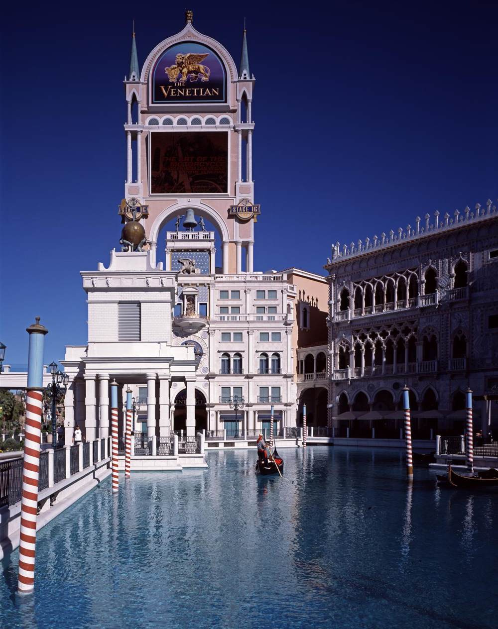 The Venetian's campanile and canal entrance shortly after opening, with a Guggenheim Las Vegas banner on the tower