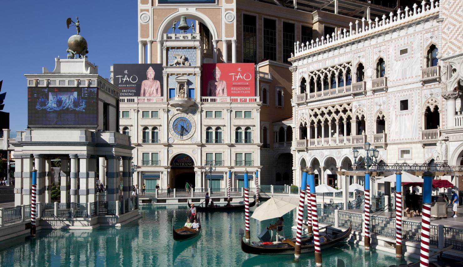 Gondolas on the Venetian's outdoor Grand Canal below the campanile and the Doge's Palace facade