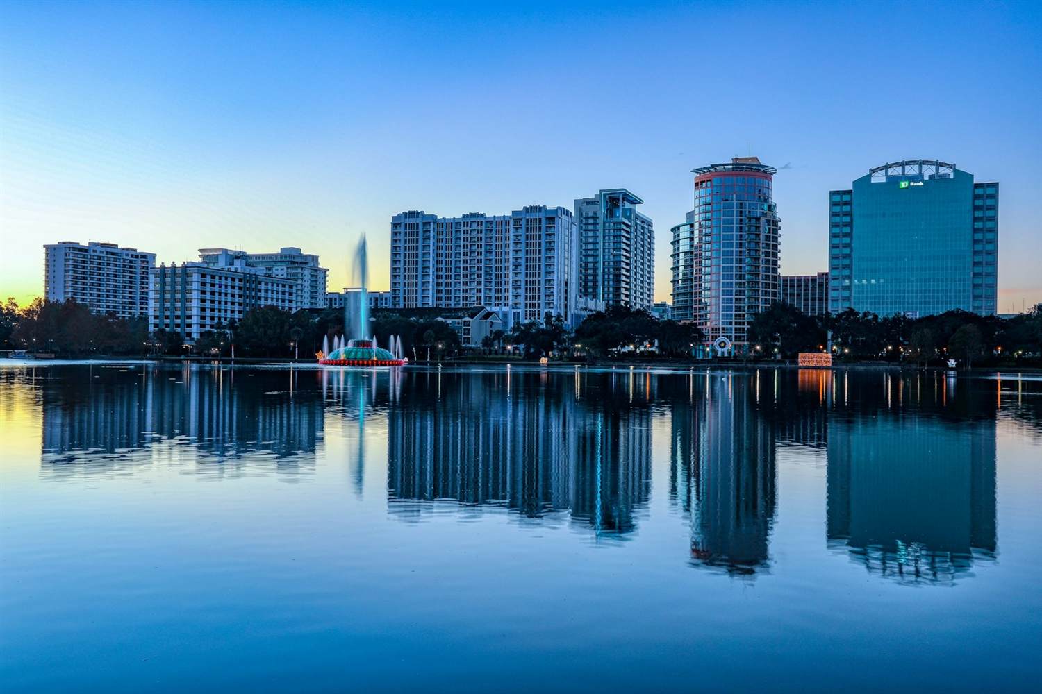 Downtown Orlando skyline across Lake Eola at sunrise