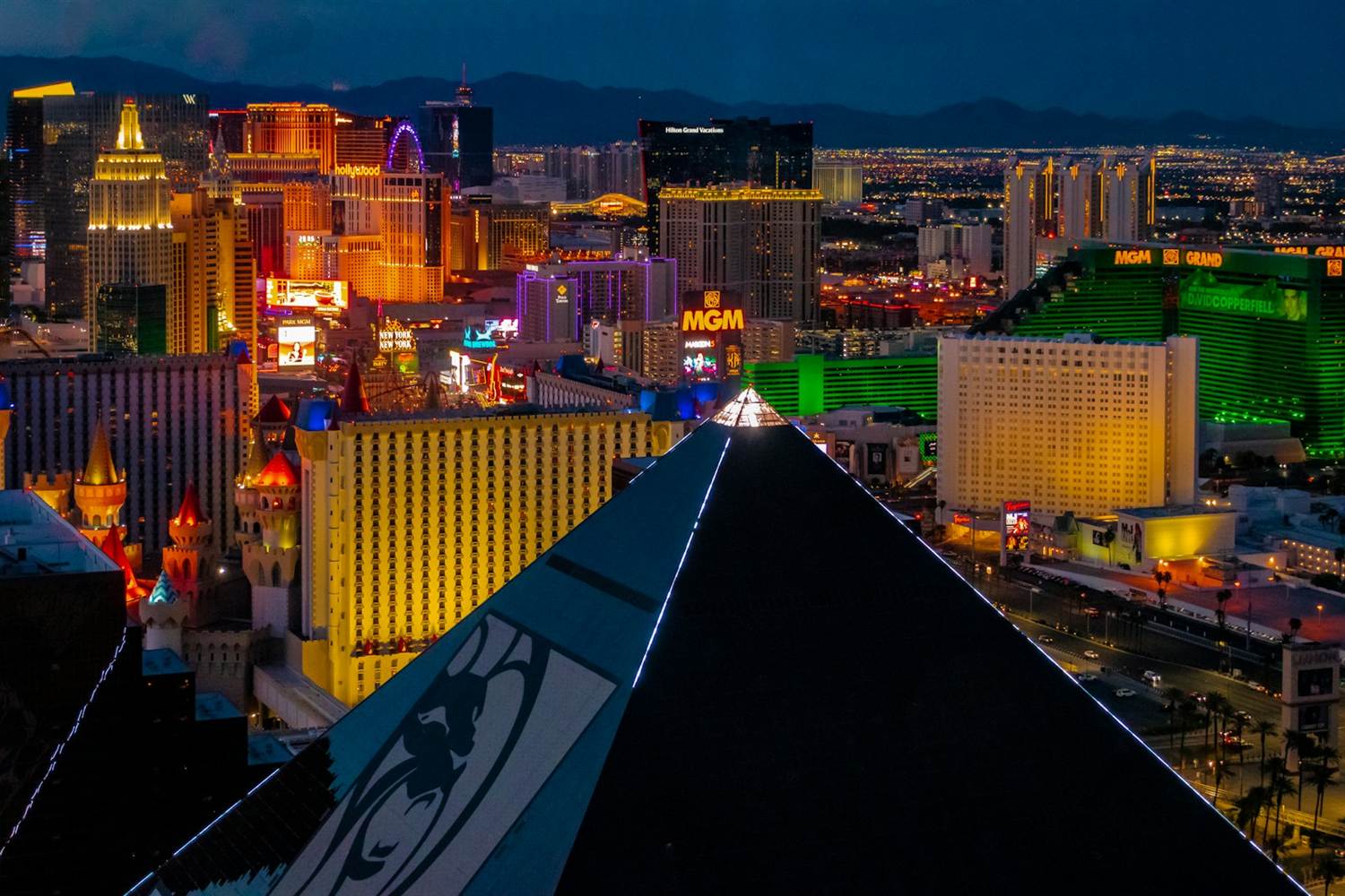 Night view over the Luxor pyramid toward MGM Grand, Excalibur and New York-New York