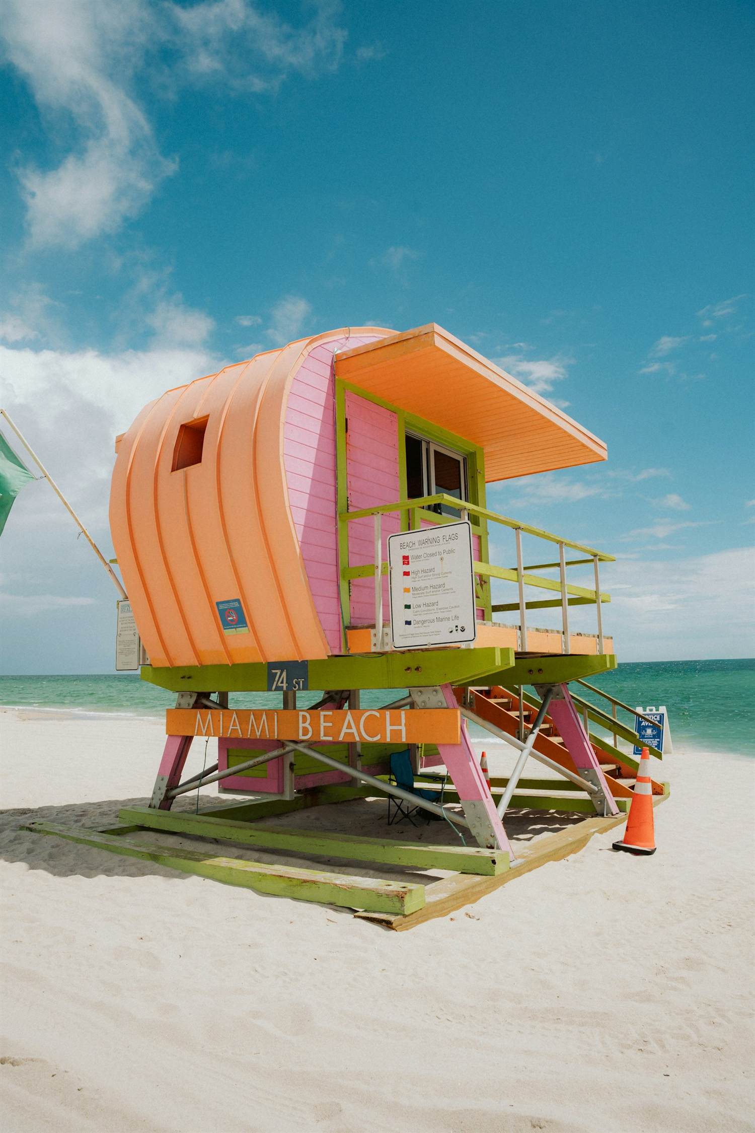 A colorful lifeguard tower on the sand at Miami Beach