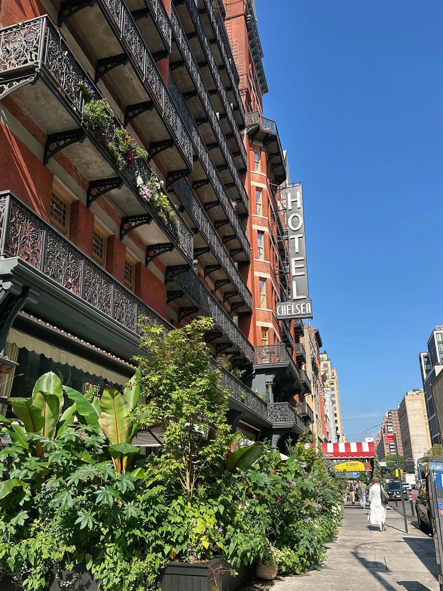 The facade of the Hotel Chelsea on a busy New York City street