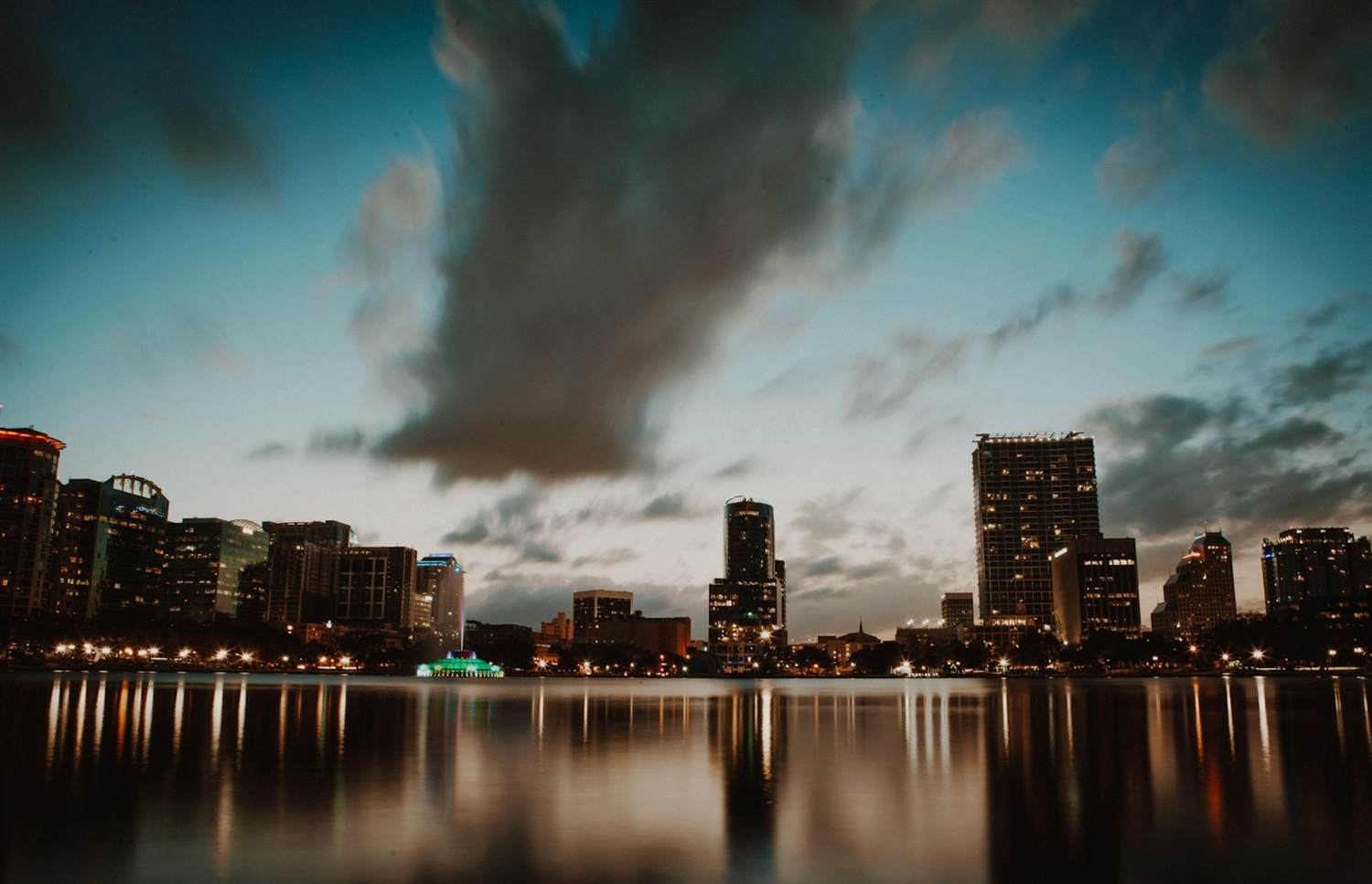 Downtown Orlando skyline reflected in Lake Eola at dusk