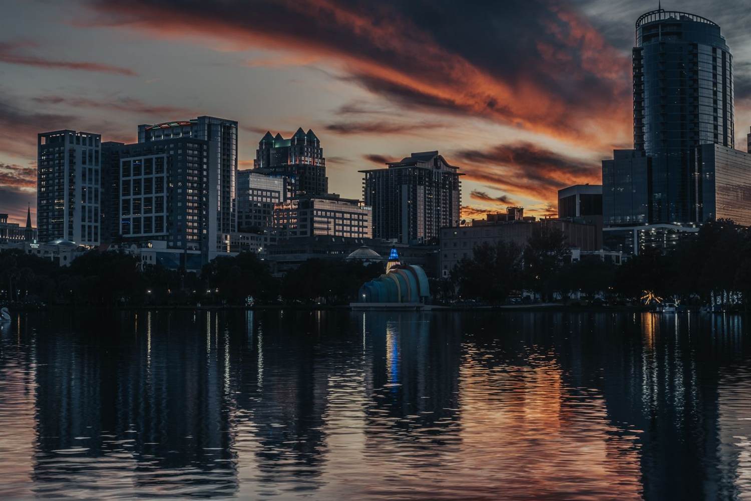 Downtown Orlando skyline reflected in Lake Eola at dusk