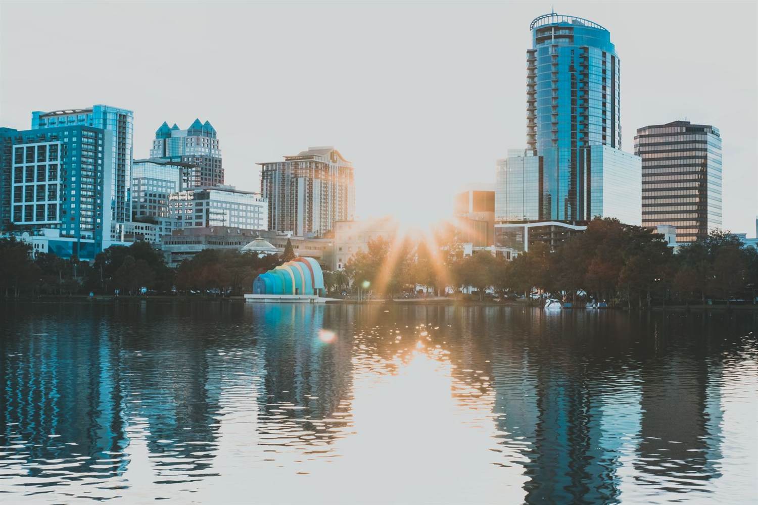 Downtown Orlando skyline at sunset with reflections on the lake