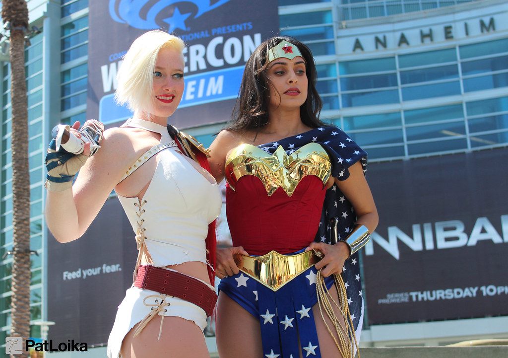 Two cosplayers, one as Wonder Woman, posing outside the Anaheim Convention Center under WonderCon Anaheim banners in 2013