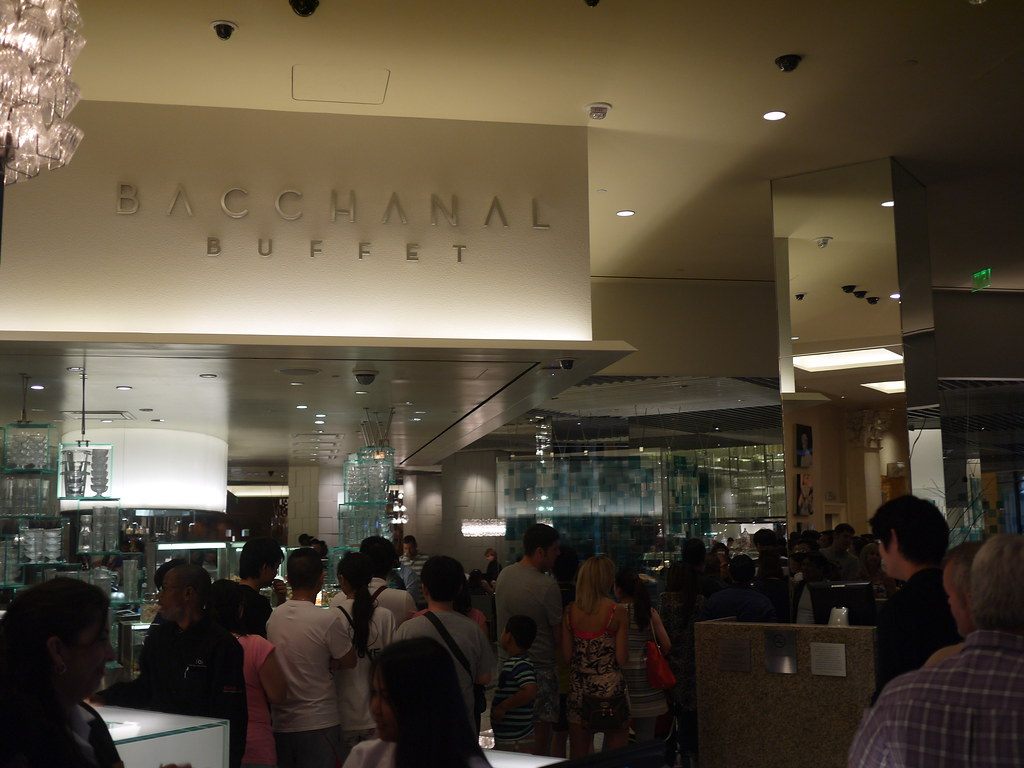 A long line of diners waiting at the entrance of the Bacchanal Buffet at Caesars Palace