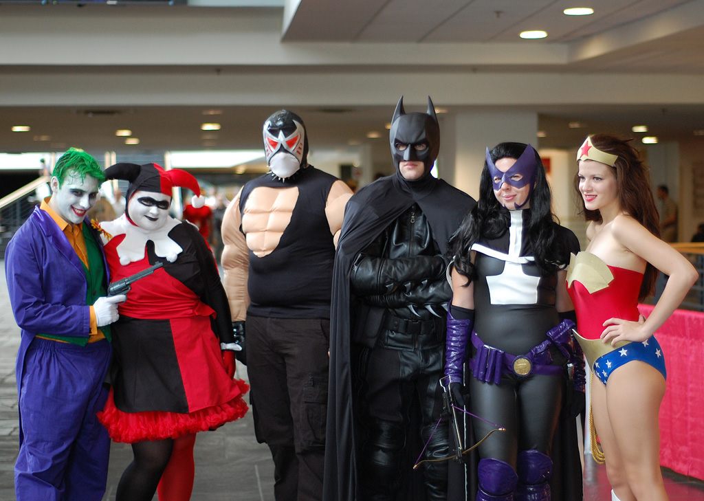 Cosplayers dressed as the Joker, Harley Quinn, Bane, Batman, Huntress and Wonder Woman posing together in a concourse at Heroes Con 2009 in uptown Charlotte