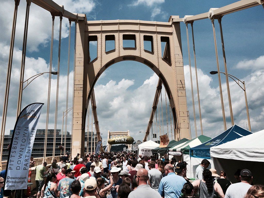 Crowds and vendor tents packing the Roberto Clemente Bridge during Picklesburgh in downtown Pittsburgh