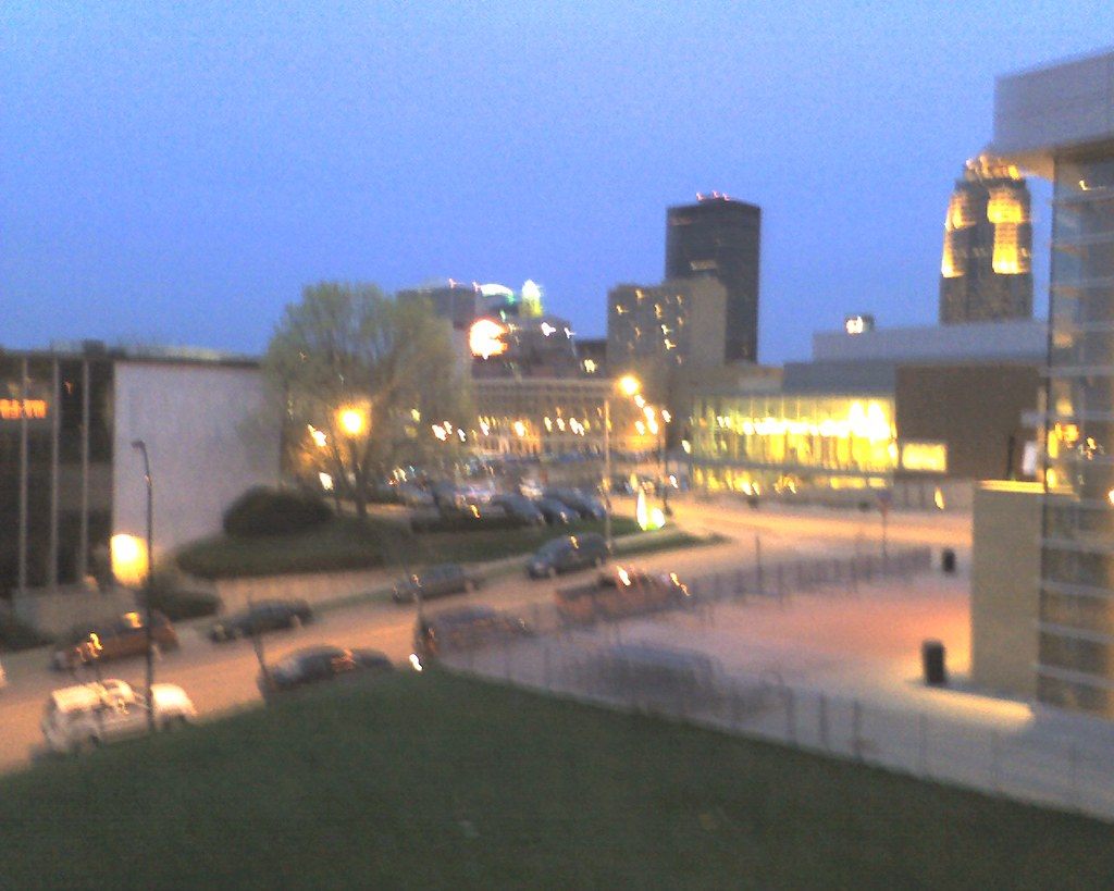 Downtown Des Moines towers and street lights at dusk, seen from beside Wells Fargo Arena